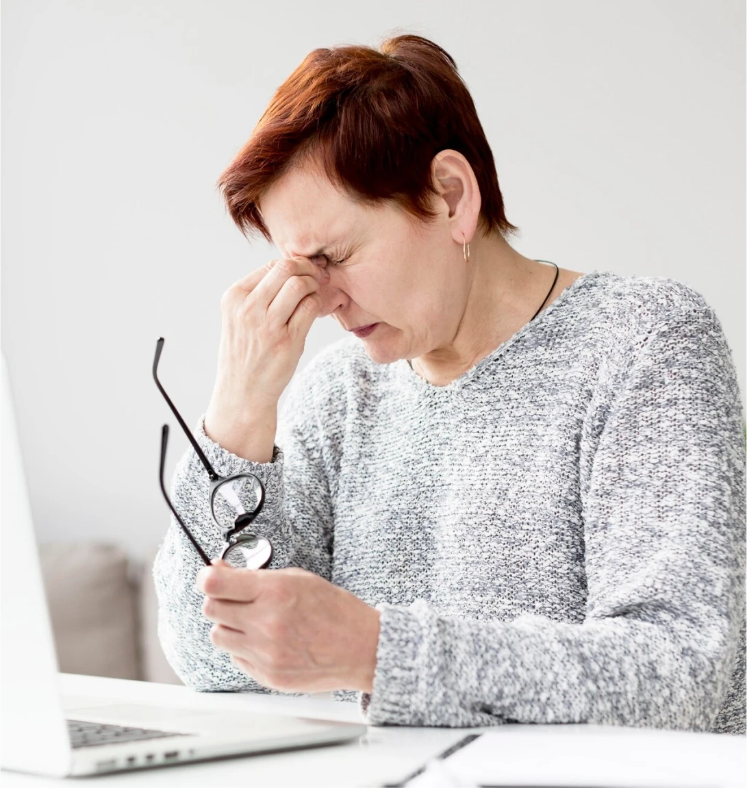 Front view of woman with anxiety at desk Front view of woman with anxiety at desk